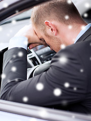 Image showing close up of businessman driving car