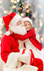 Image showing smiling little girl with santa claus