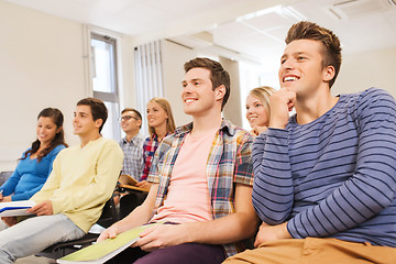 Image showing group of smiling students in lecture hall