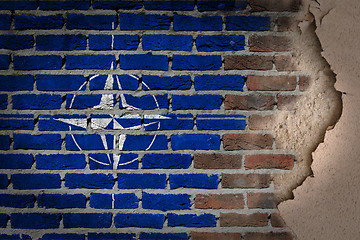 Image showing Dark brick wall with plaster - NATO