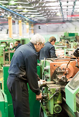 Image showing Milling-machine operator works at  machine