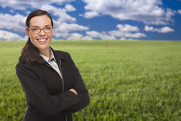 Image showing Confident Woman in Grass Field Looking At Camera