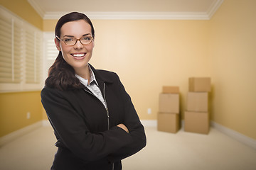 Image showing Mixed Race Woman in Empty Room with Boxes