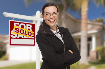 Image showing Mixed Race Woman in Front of House and Sold Sign