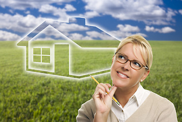 Image showing Woman and Grass Field with Ghosted House Figure Behind