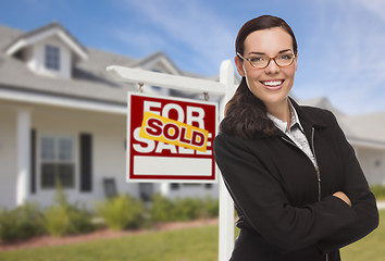 Image showing Mixed Race Woman in Front of House and Sold Sign