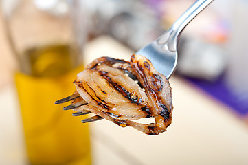 Image showing grilled onion on a fork