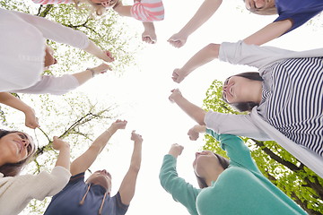 Image showing young friends staying together outdoor in the park