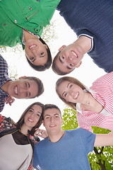 Image showing young friends staying together outdoor in the park