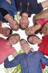 Image showing young friends staying together outdoor in the park