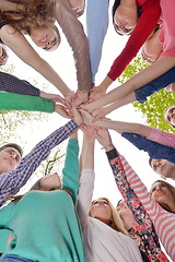 Image showing young friends staying together outdoor in the park