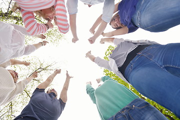 Image showing young friends staying together outdoor in the park