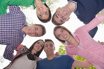 Image showing young friends staying together outdoor in the park