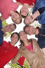 Image showing young friends staying together outdoor in the park