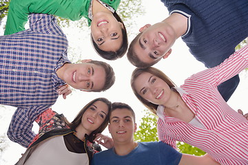 Image showing young friends staying together outdoor in the park