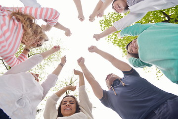 Image showing young friends staying together outdoor in the park