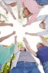 Image showing young friends staying together outdoor in the park