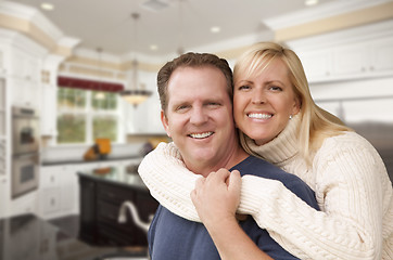 Image showing Happy Couple Inside Beautiful Custom Kitchen