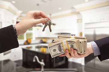 Image showing Handing Over Cash for Keys Inside Beautiful Home