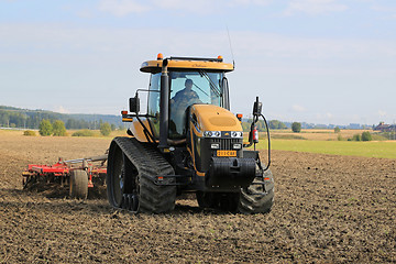 Image showing Challenger Agricultural Crawler Tractor on Field in Autumn