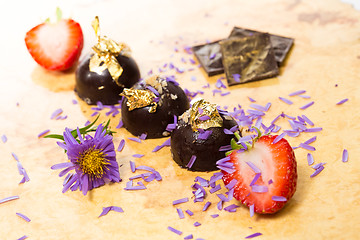 Image showing dark chocolate on a wooden table.