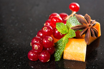Image showing Assortment of delicious cheese and fruits 