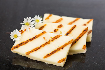 Image showing Halloumi cheese frying in grill pan.