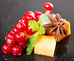 Image showing Assortment of delicious cheese and fruits 