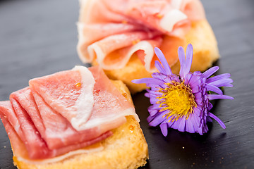 Image showing Slices of figs in Prosciutto