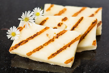 Image showing Halloumi cheese frying in grill pan.