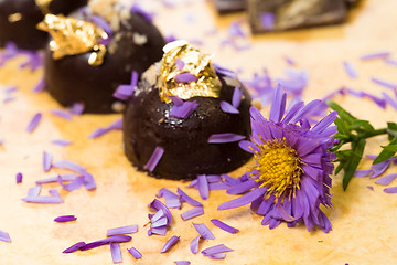 Image showing dark chocolate on a wooden table.