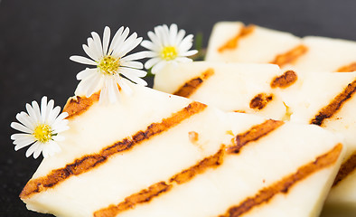 Image showing Halloumi cheese frying in grill pan.