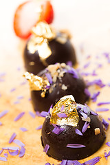 Image showing dark chocolate on a wooden table.