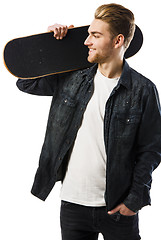 Image showing Young man with a skateboard