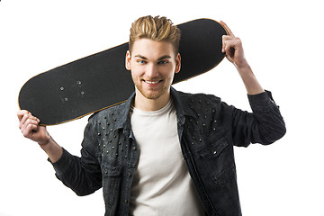 Image showing Young man with a skateboard