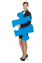 Image showing Businesswoman with a puzzle piece