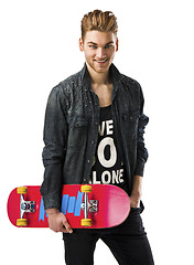 Image showing Young man with a skateboard