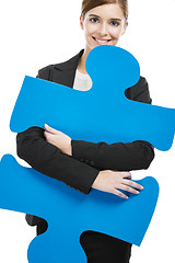 Image showing Businesswoman with a puzzle piece