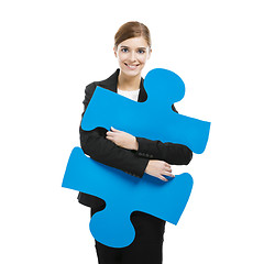 Image showing Businesswoman with a puzzle piece