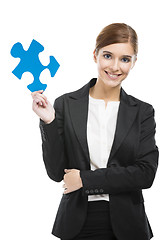 Image showing Businesswoman with a puzzle piece
