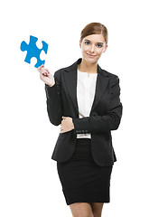 Image showing Businesswoman with a puzzle piece