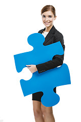 Image showing Businesswoman with a puzzle piece