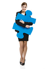 Image showing Businesswoman with a puzzle piece