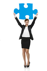 Image showing Businesswoman with a puzzle piece