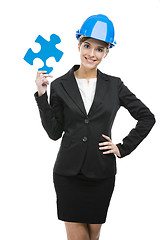 Image showing Female engineer with a puzzle piece