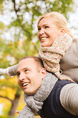 Image showing smiling couple having fun in autumn park