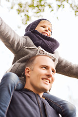 Image showing happy family having fun in autumn park