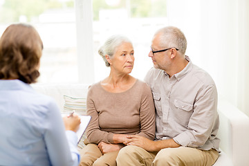 Image showing senior couple hugging at home