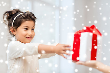 Image showing smiling little girl with gift box