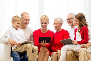 Image showing smiling family with tablet pc computers at home